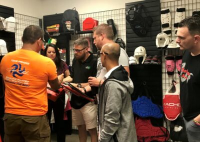 School owners checking out Macho Martial Arts gear